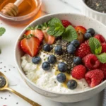 Cottage cheese bowl with mixed berries, chia seeds, and honey for weight loss.